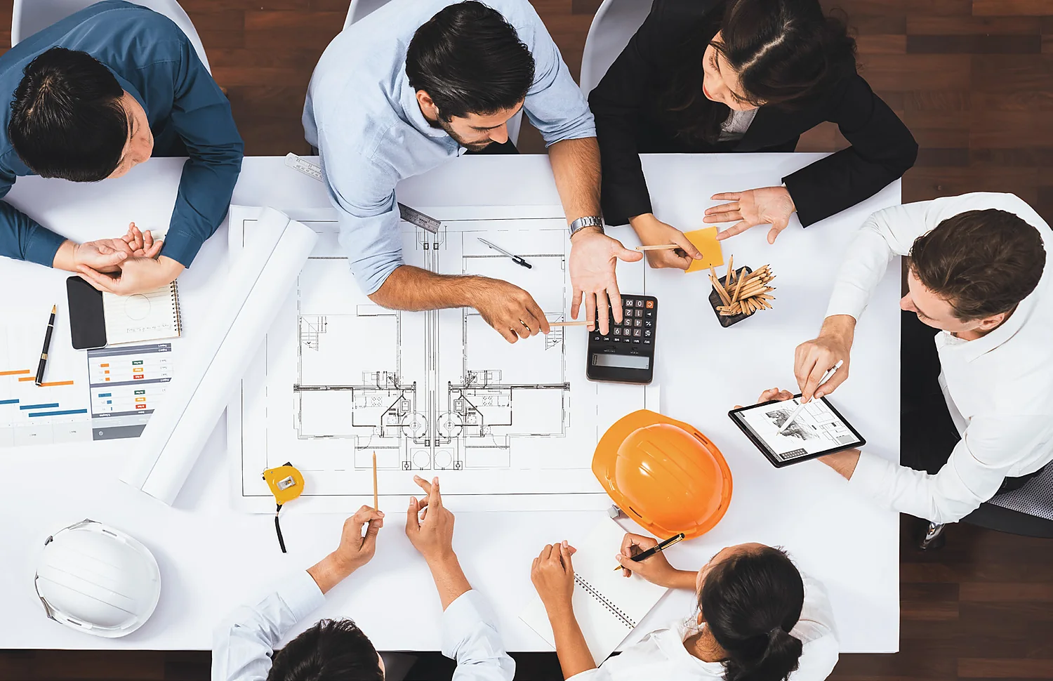 Engineering team reviewing construction plans